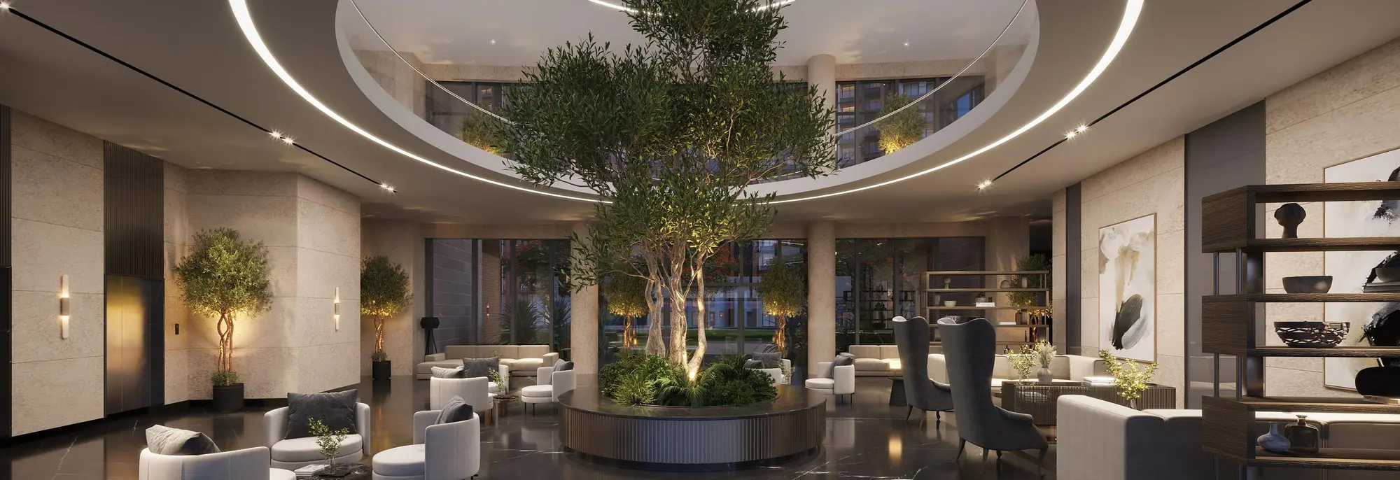 Clubhouse lobby with a central tree under a circular skylight