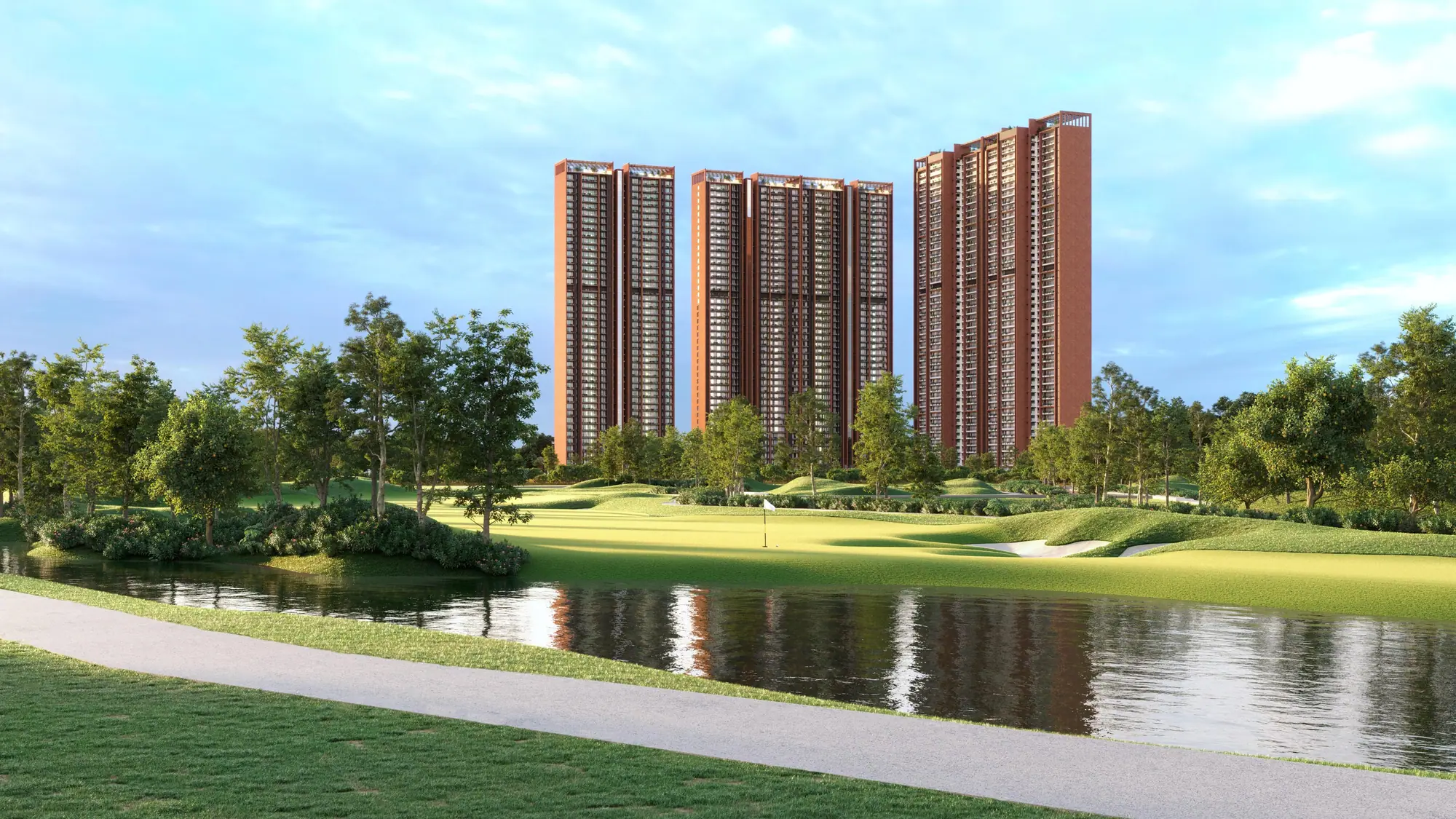 SOBHA Aranya towers reflected in a lake on the Karma Lakelands golf course